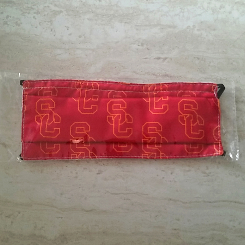 NWT USC Red/yellow pattern mask. One size.